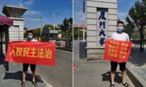 Người Trung Quốc giăng biểu ngữ yêu cầu chính quyền hạ đài
