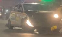 Hà Nội: Xe taxi mất lái, tông bay hai người đang chờ đèn đỏ